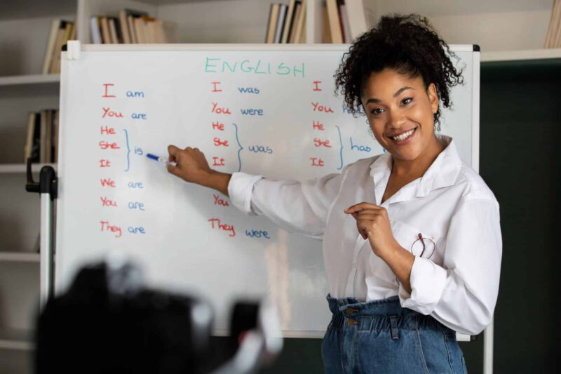 teacher in front of board